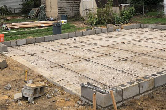 Laying down reinforced steel for concrete base